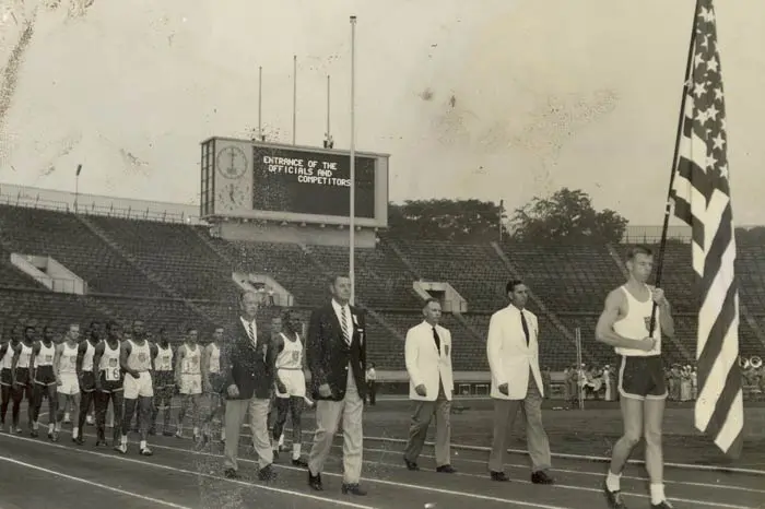family posing with mascot