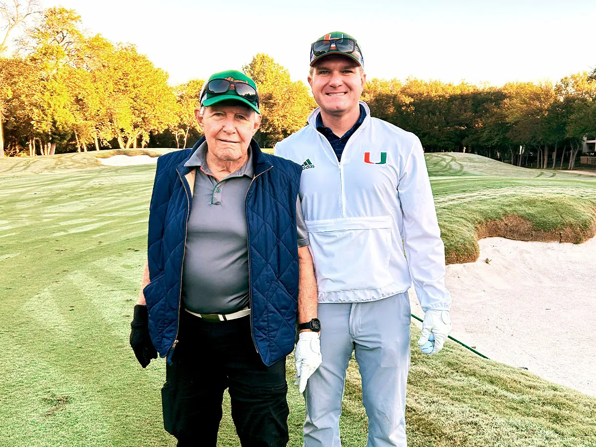 family posing with mascot
