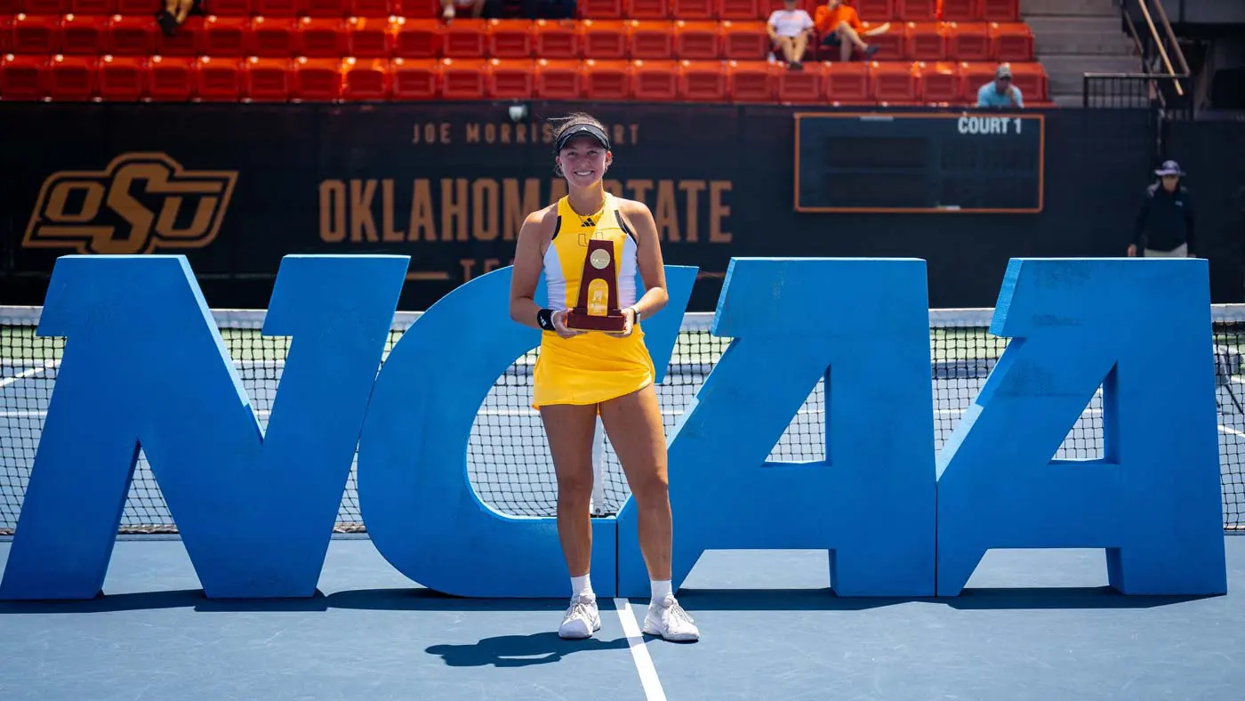 Athlete posing with trophy