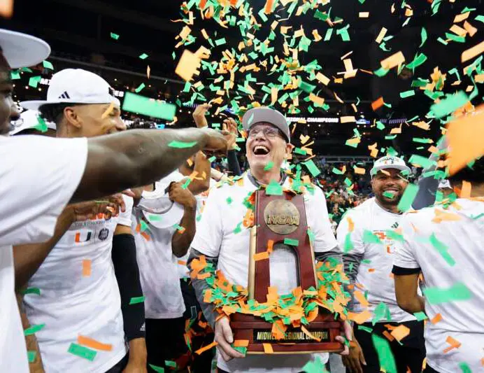 Athletes celebrating with trophy