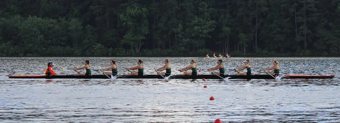 women rowing on the lake